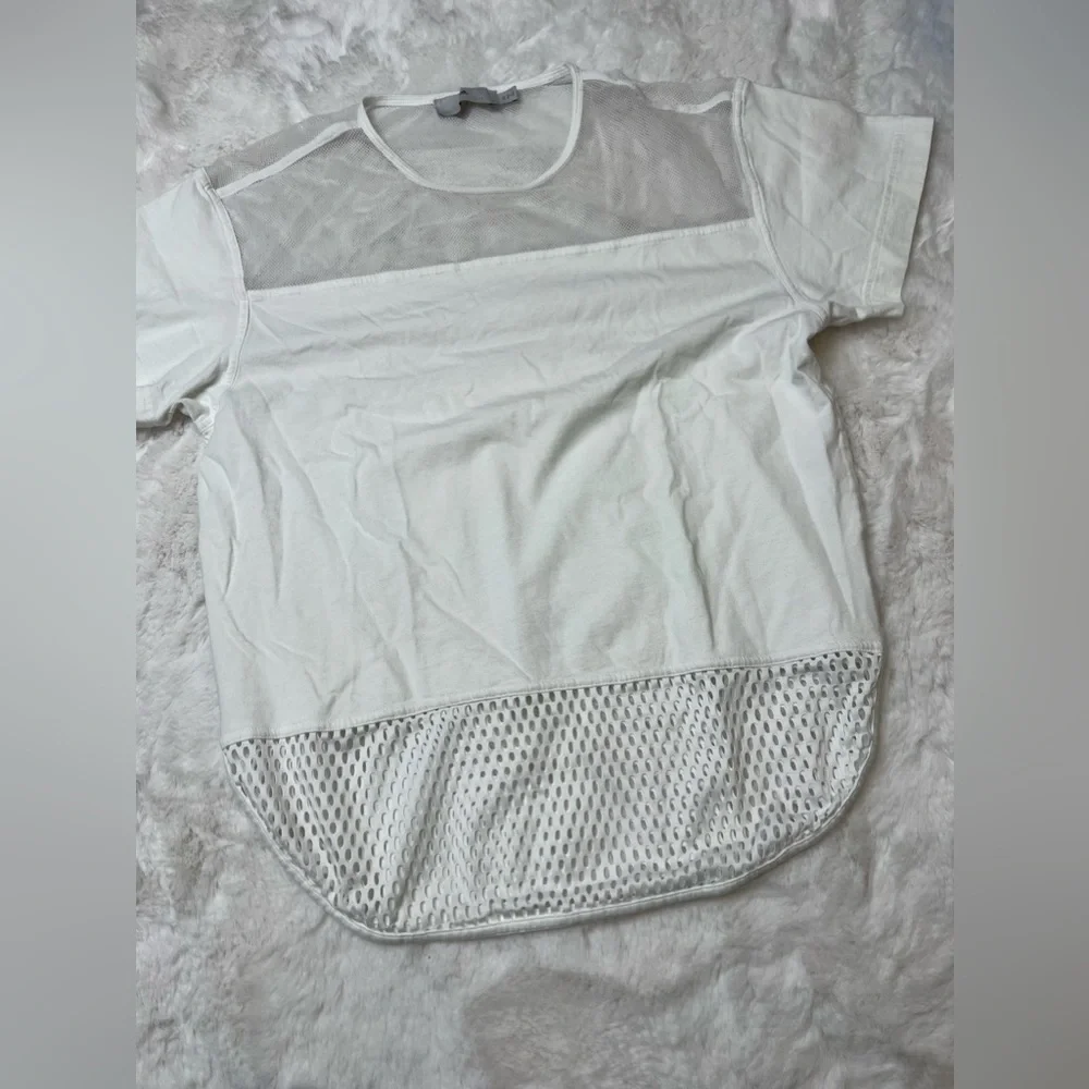 White adidas work out active shirt with mesh on the top and bottom. - Picture 1 of 8